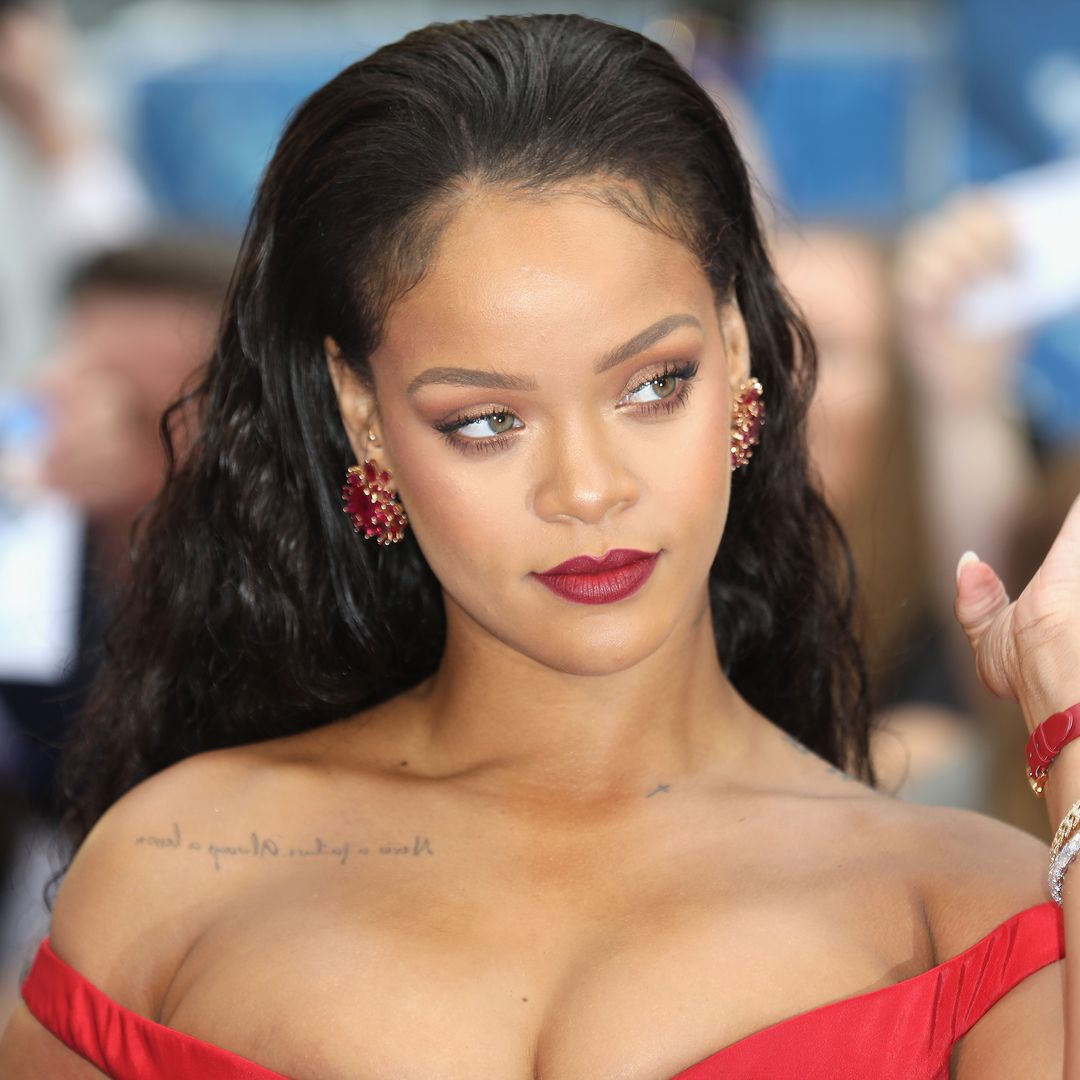 Rihanna causes a stir as she poses in red hot lace lingerie