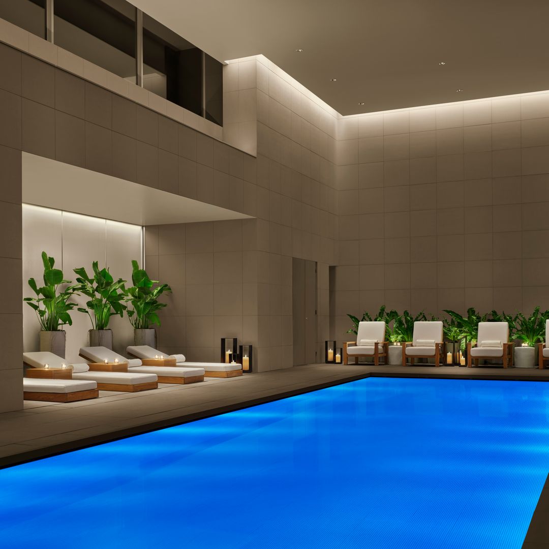 indoor pool with lounge beds in tokyo hotel