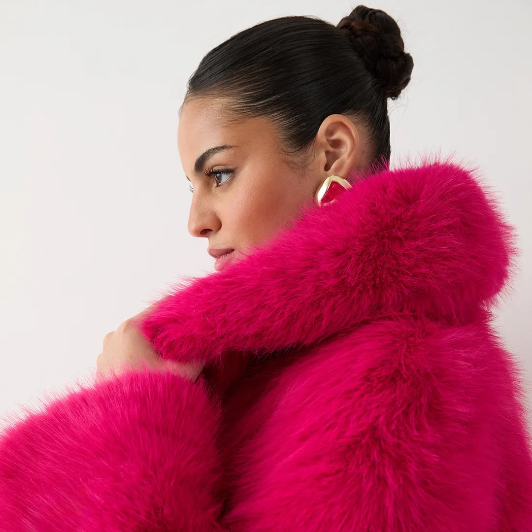 model wearing hot pink fur coat 