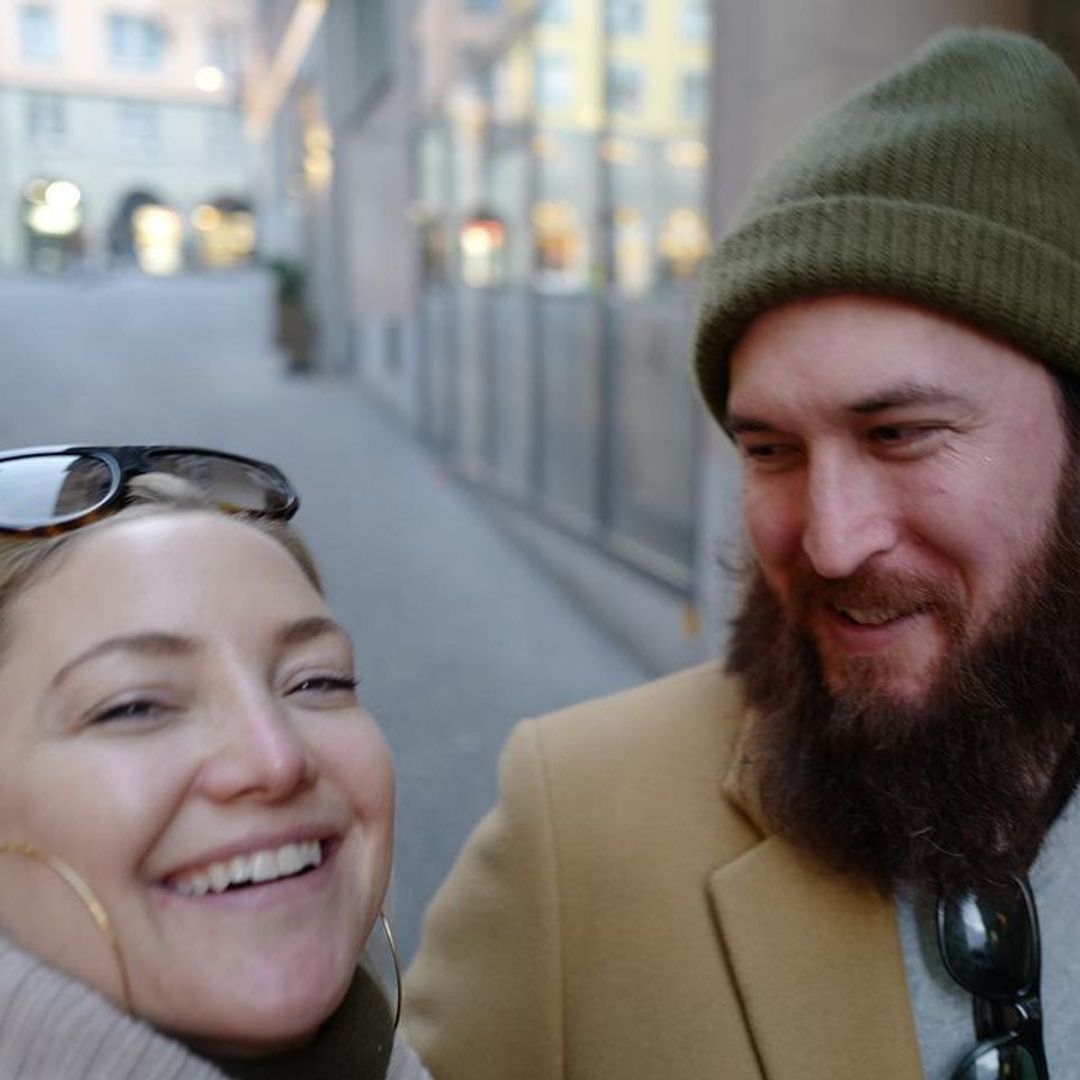 Kate and Danny laughing on a street in a selfie