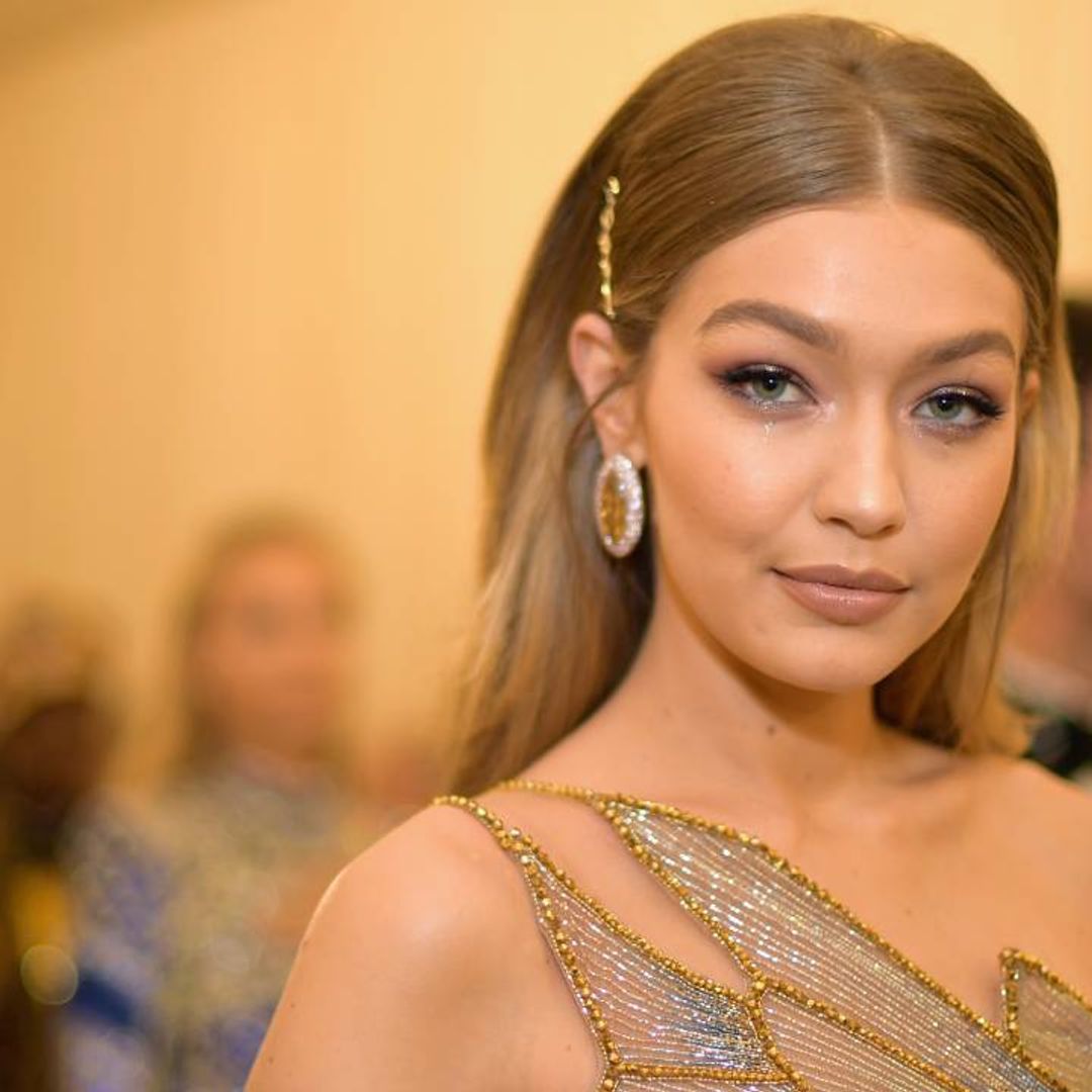 Gigi Hadid steps out with baby Khai in a blue trench coat everyone needs for spring