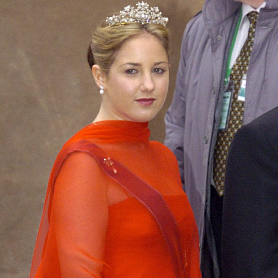 Princess Theodora in a tiara and a red dress