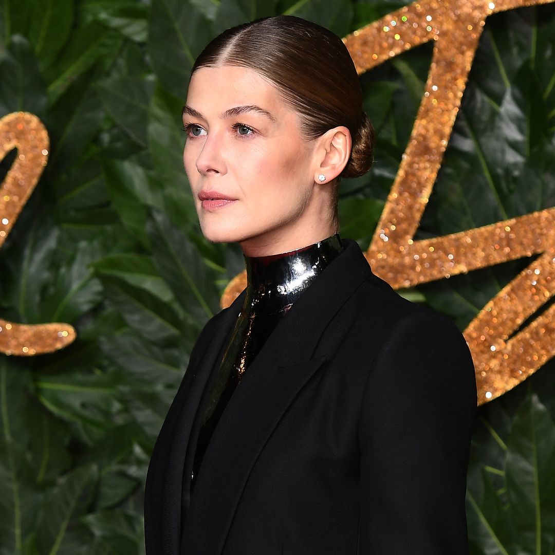 Rosamund Pike reveals 'smashed up' face injury as real reason behind shielded lace look at Golden Globes