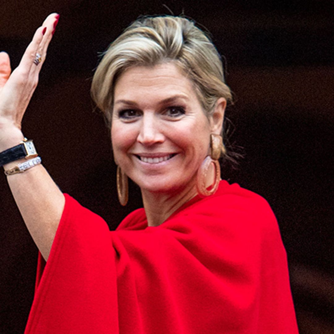 Royal style Queen! Maxima wows in berry-red dress with matching cape