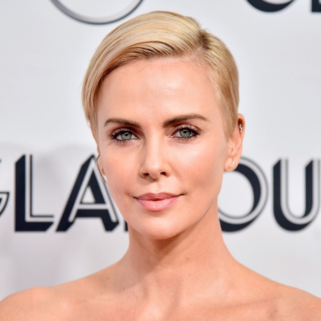 Charlize Theron wears just a necklace for striking Dior campaign photo