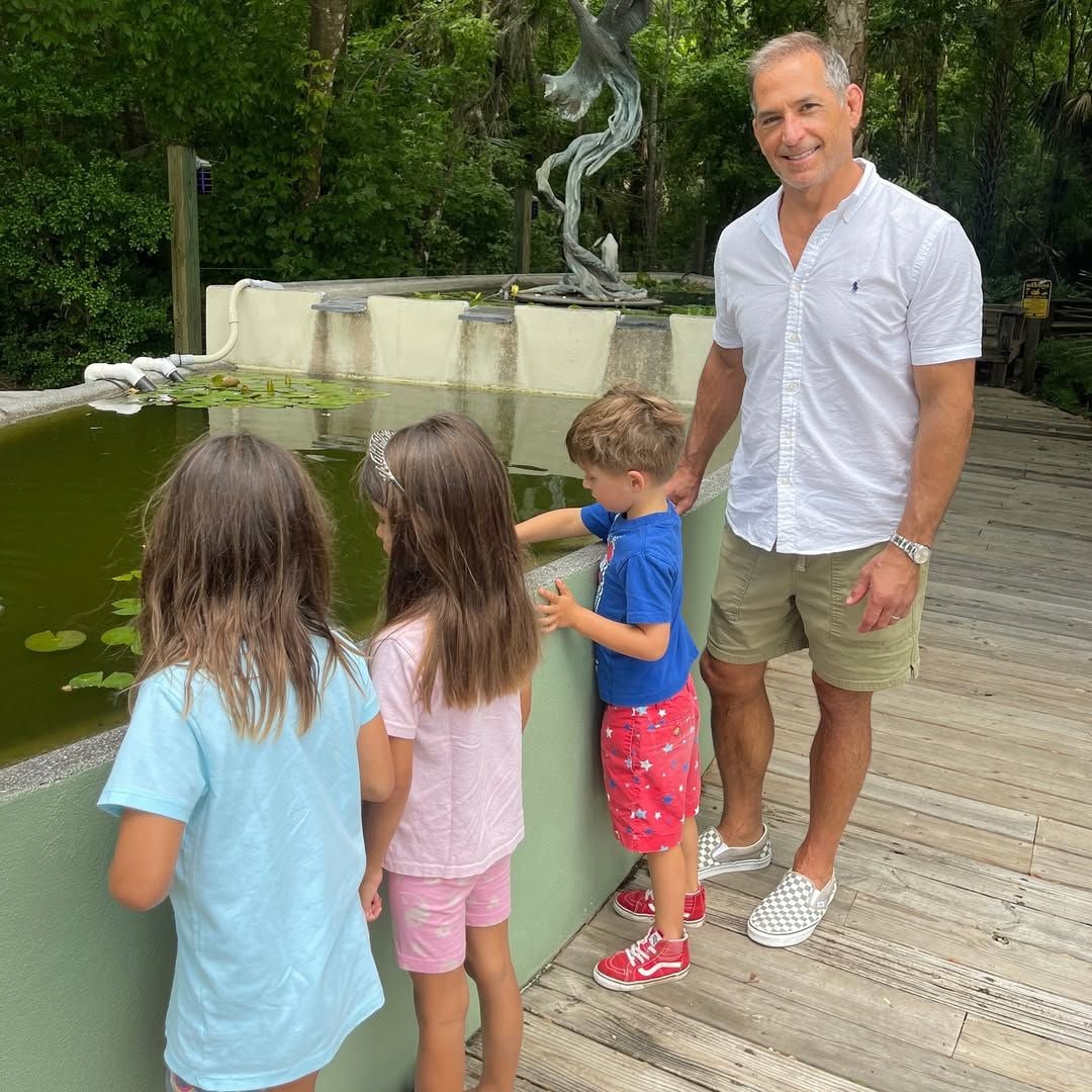 Bobby Deen with his three children looking over a pond, shared on Instagram