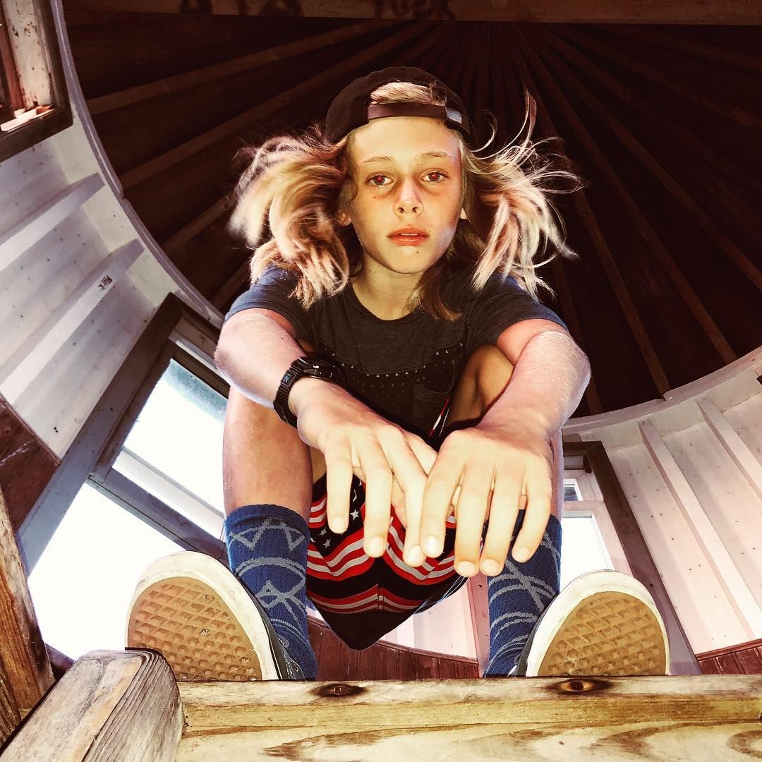 Julia Roberts' son Henry Moder poses for a photo with his hair flowing down past his face while in a shed, shared on Instagram