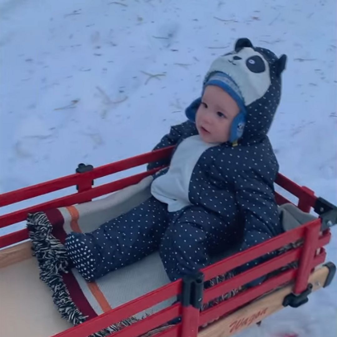 Meghan Markle cheers as she pulls son Archie on a sleigh in the snow