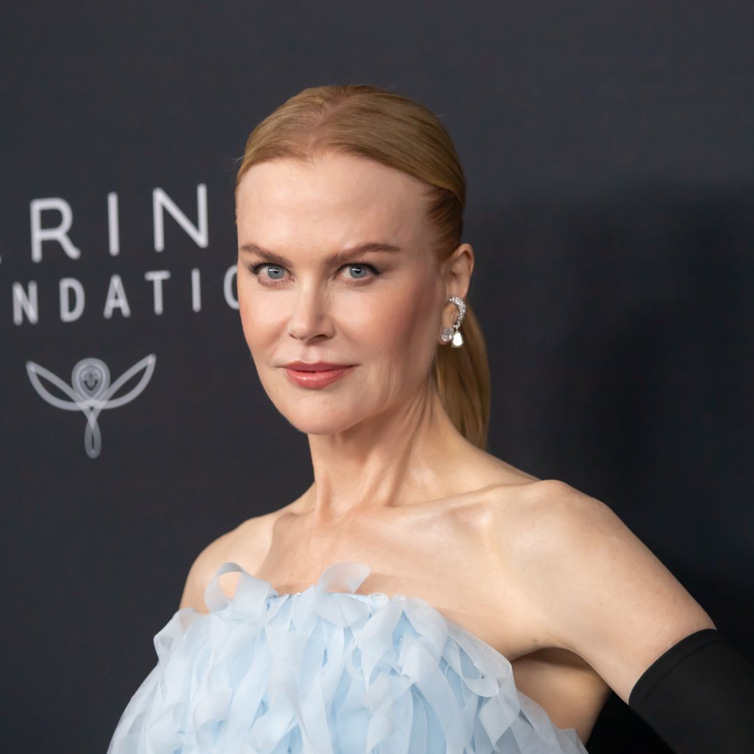 Nicole Kidman is a sultry vixen in slinky thigh-split dress and sheer stockings
