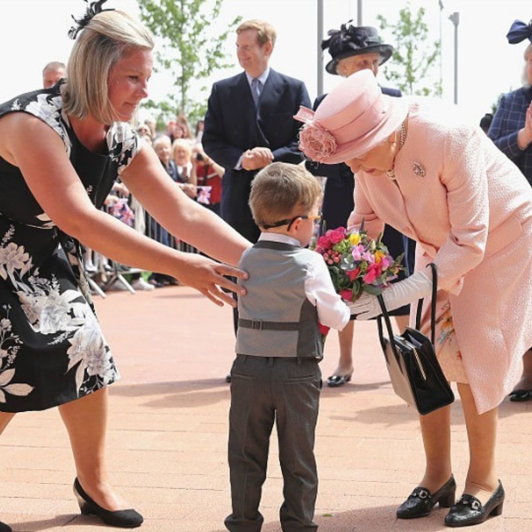 Queen Elizabeth handles a crying toddler just like any grandmother