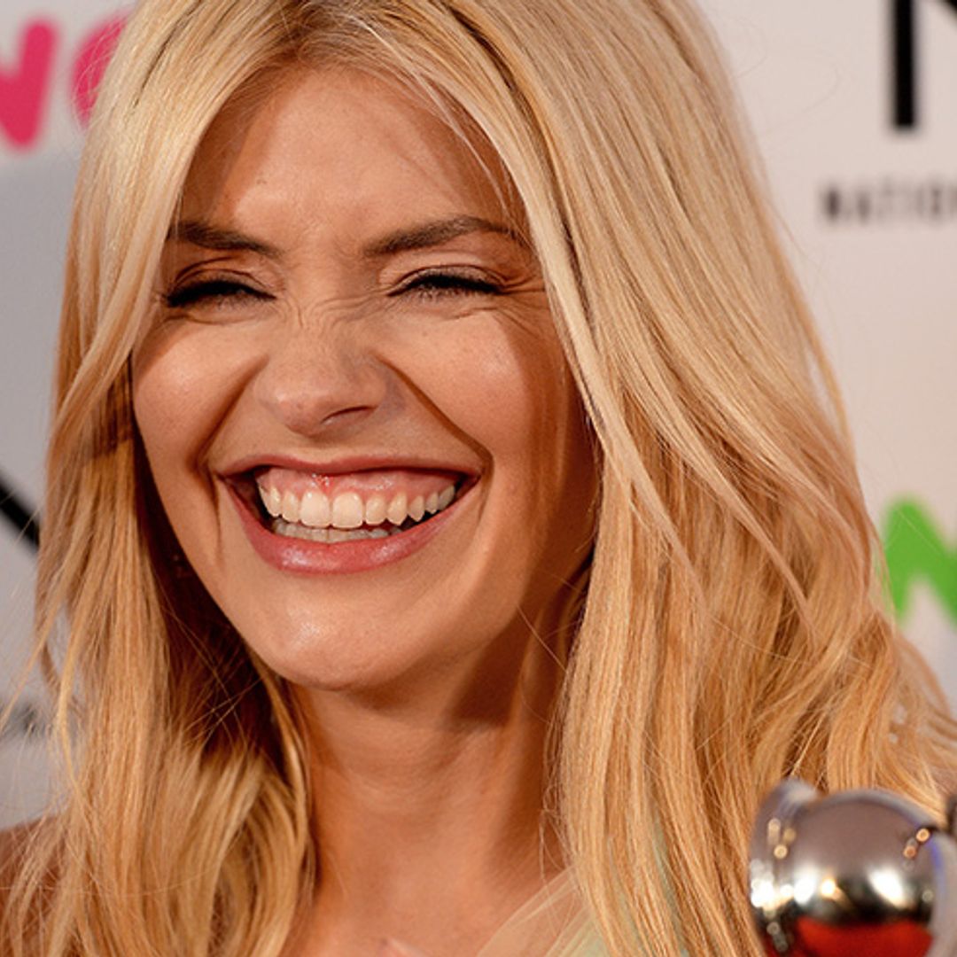 Holly Willoughby celebrates win in red skater dress