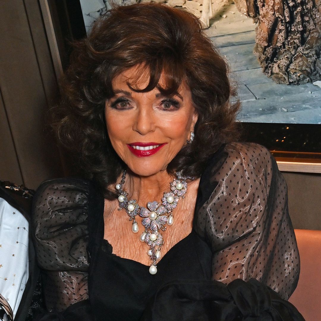 Joan Collins, 91, is ageless in printed midi dress and heels