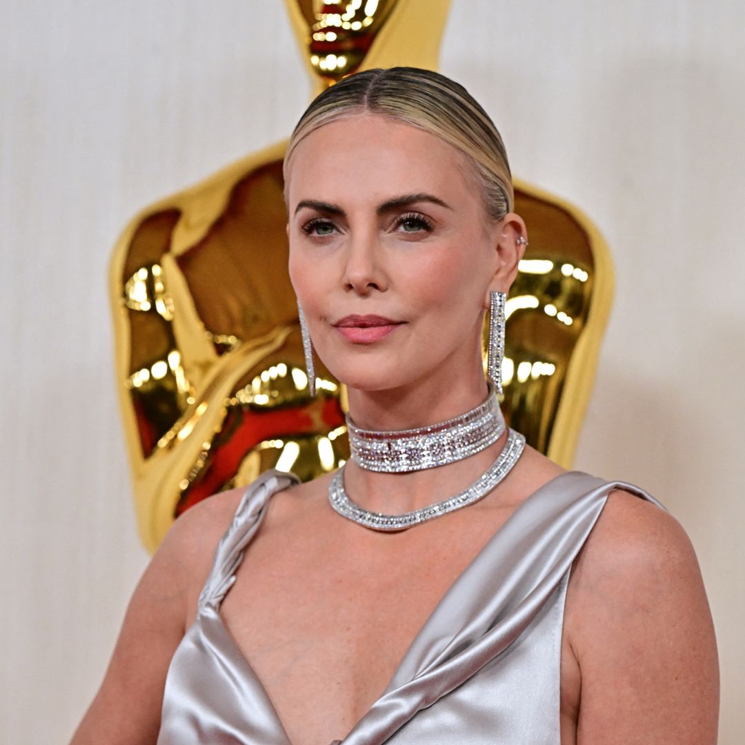 Charlize Theron is a goddess in pink silk Dior gown as she steps out on Oscars 2024 red carpet