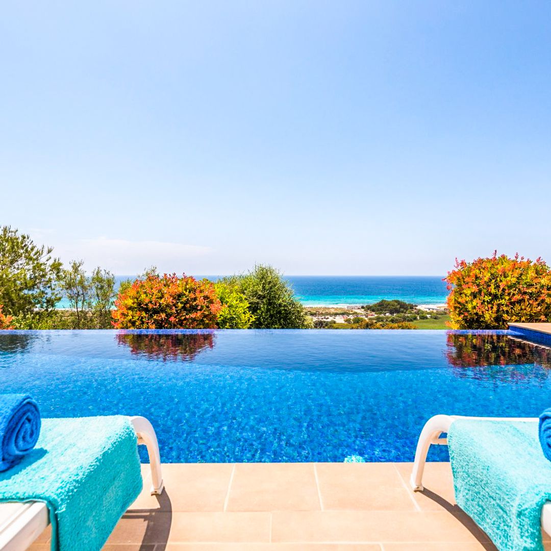 Villa Privilege pool area with two loungers