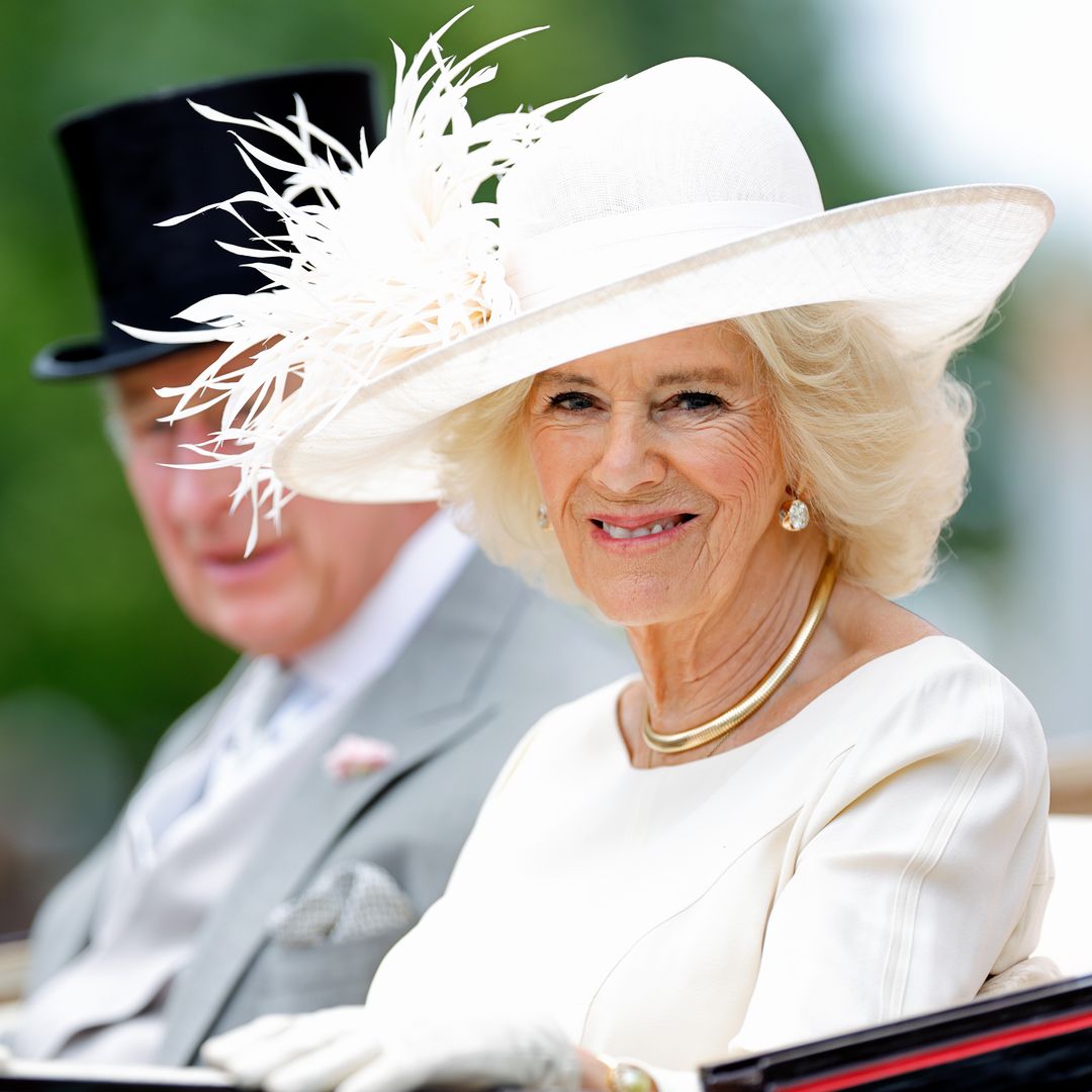 Queen Camilla is a regal vision in serene all-white look