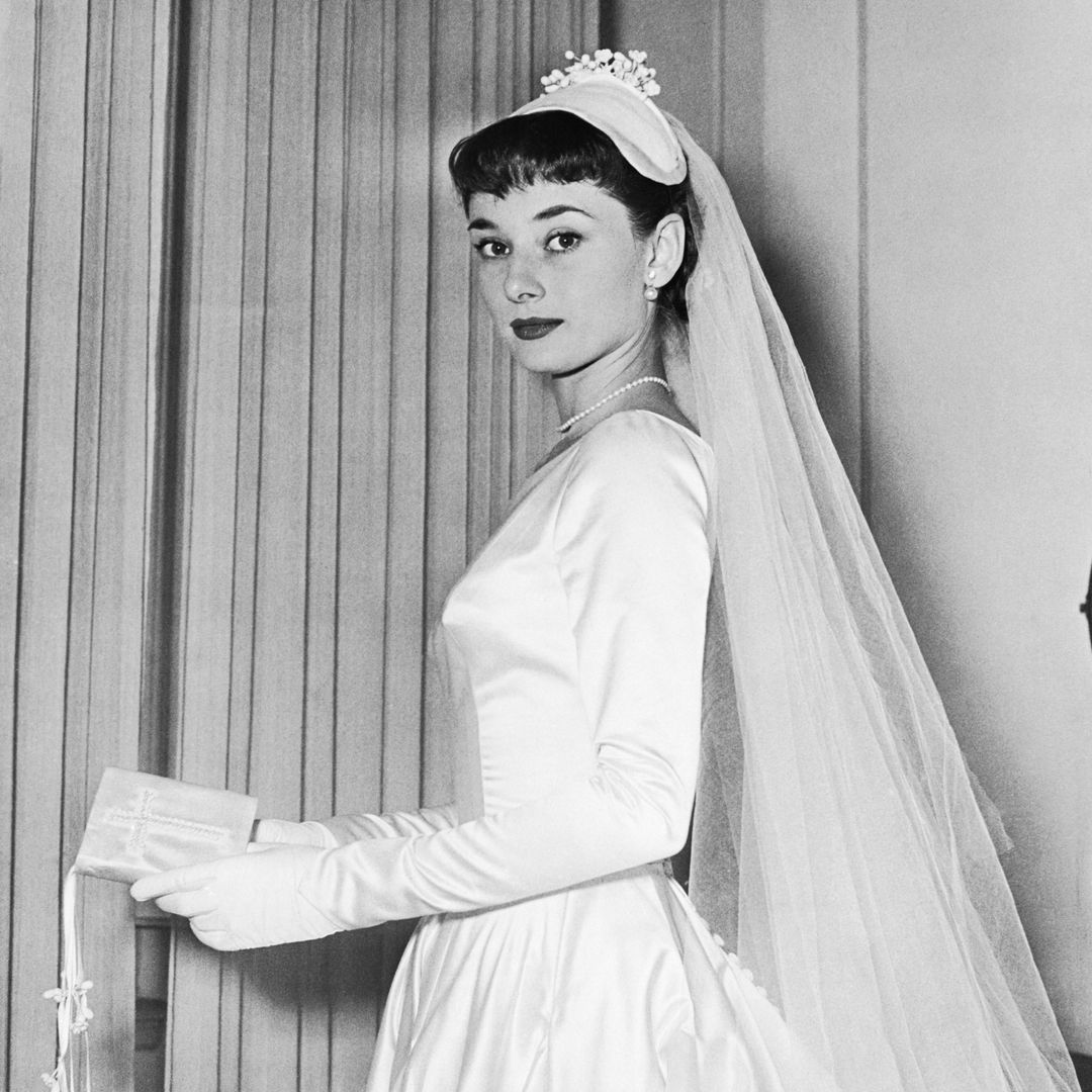 Audrey Hepburn wears the wedding gown designed by Zoe Fontana of Rome for her marriage to James Hanson.
