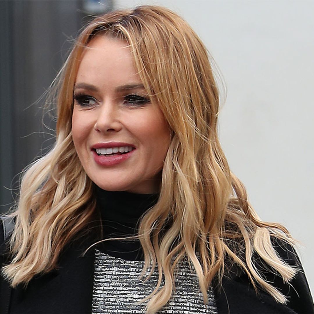 Amanda Holden's grey tweed dress goes perfectly with her black knee-high boots