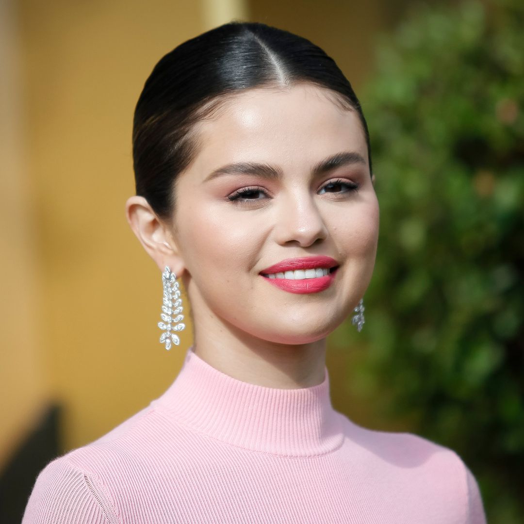 Selena Gomez is a dream in yellow oversized sweater and it's available to shop