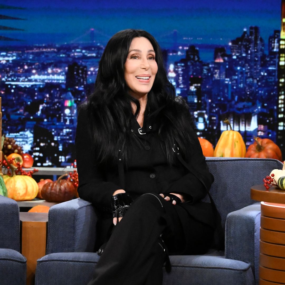 Cher looks incredible in shimmering top and studded jeans during Christmas in Rockefeller