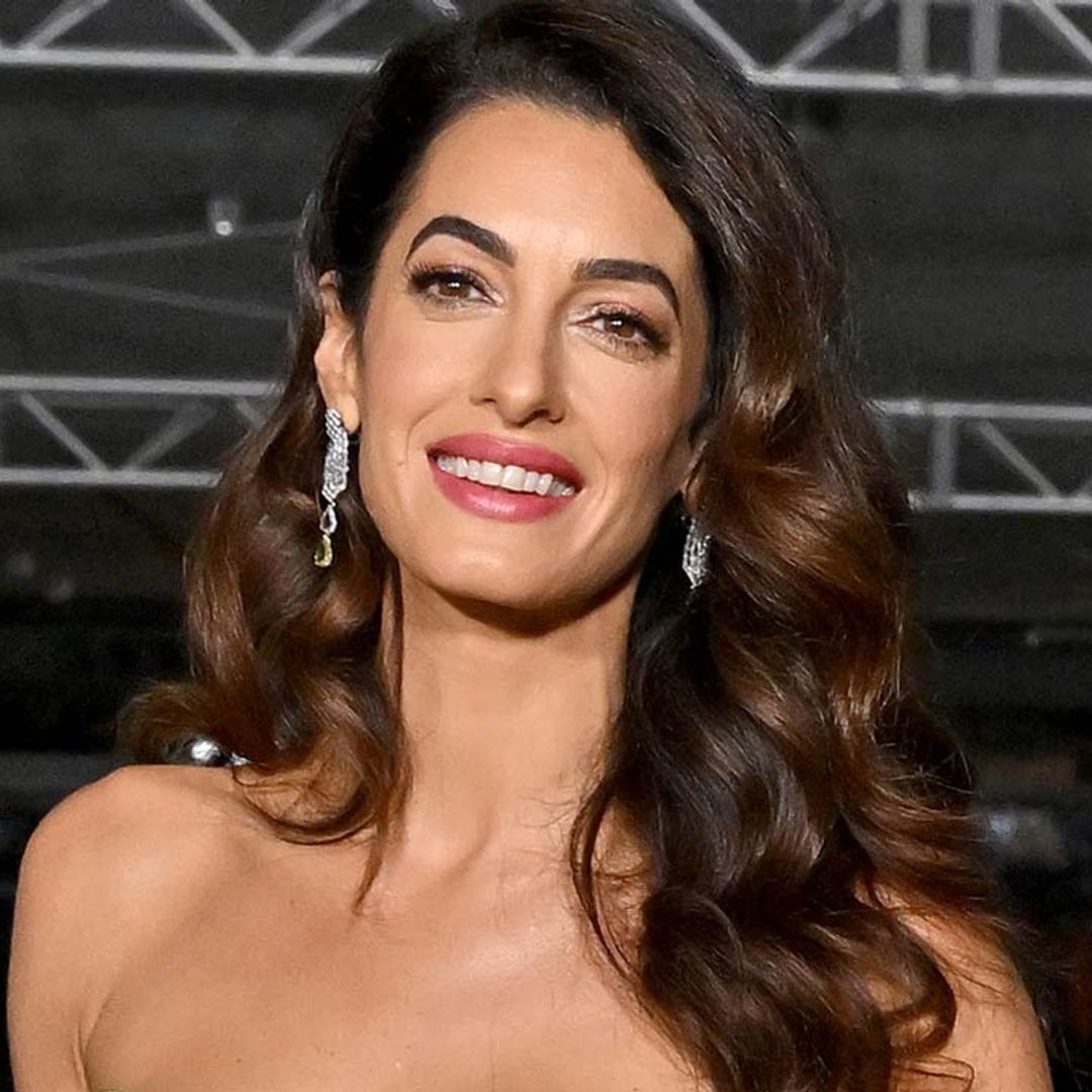 Amal Clooney looks awe-inspiring in cut-out chiffon gown alongside George Clooney