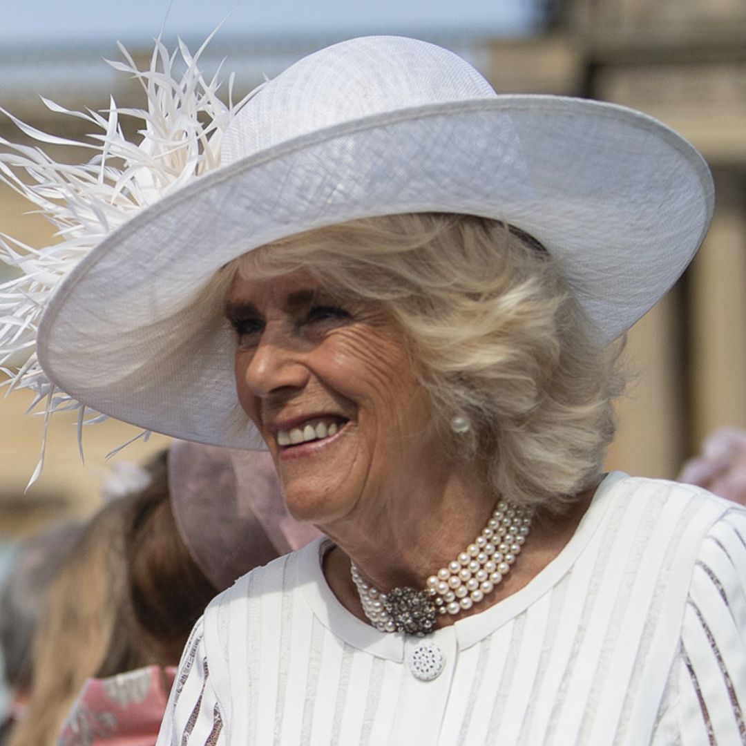 The Duchess of Cornwall wows in white at first garden party of the year