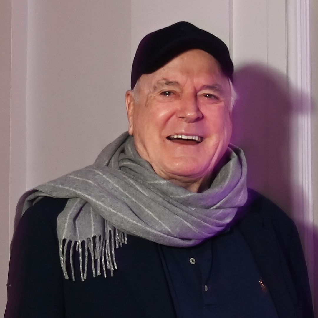 John Cleese, 86, rare outing with wife, Jennifer, 53, for surprise party full of A-listers