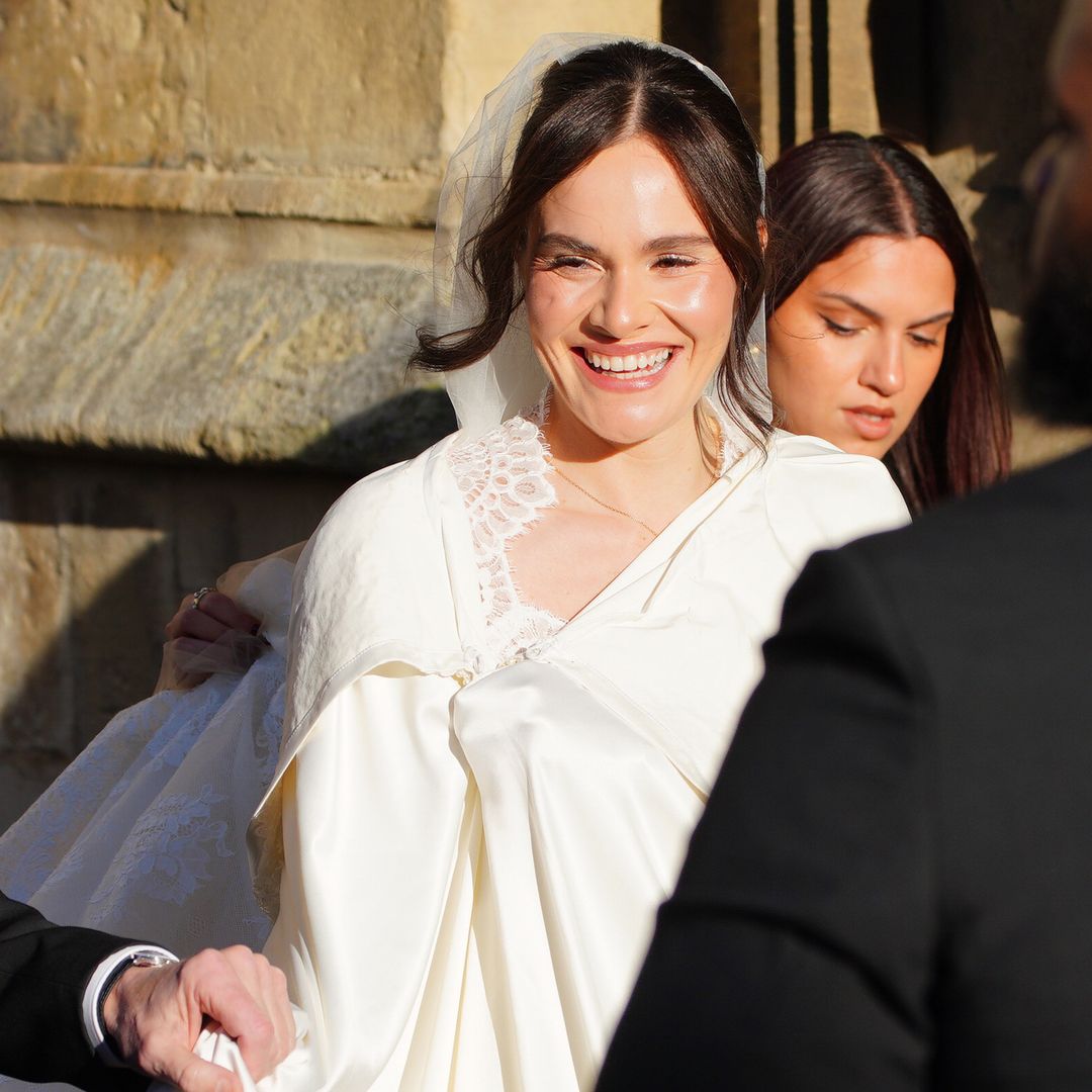 Holly Ramsay 'mobbed' as she arrives at wedding to Adam Peaty alongside dad Gordon - video