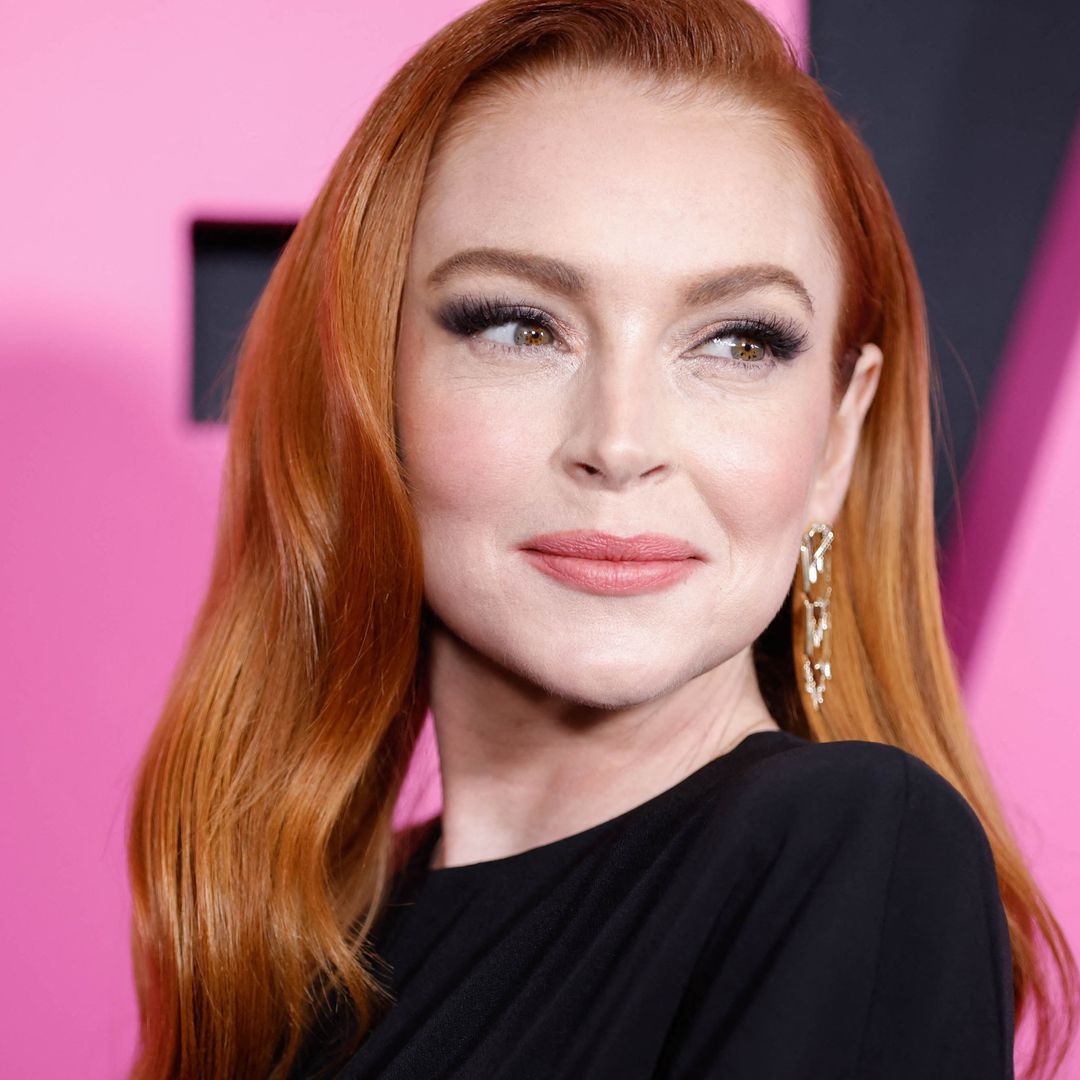 Lindsay Lohan looks 'so fetch' in cut-out gown on Mean Girls pink carpet after welcoming first child