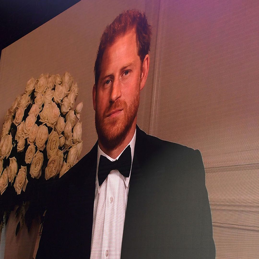 Prince Harry grins as he cracks a joke about tuxedos at GQ awards