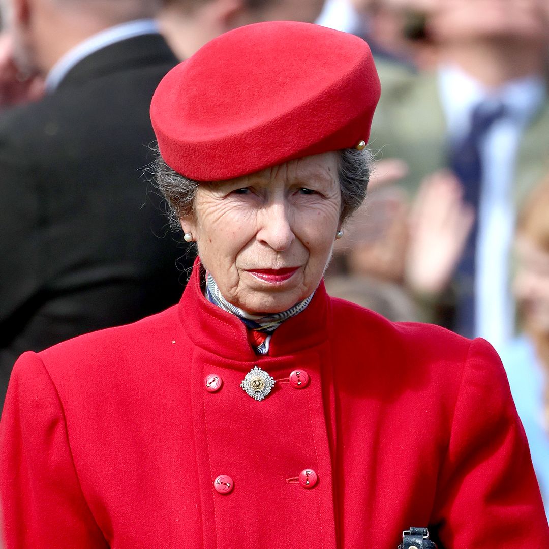 Princess Anne is a lady in red rocking silhouette-skimming coat and cherry midi skirt