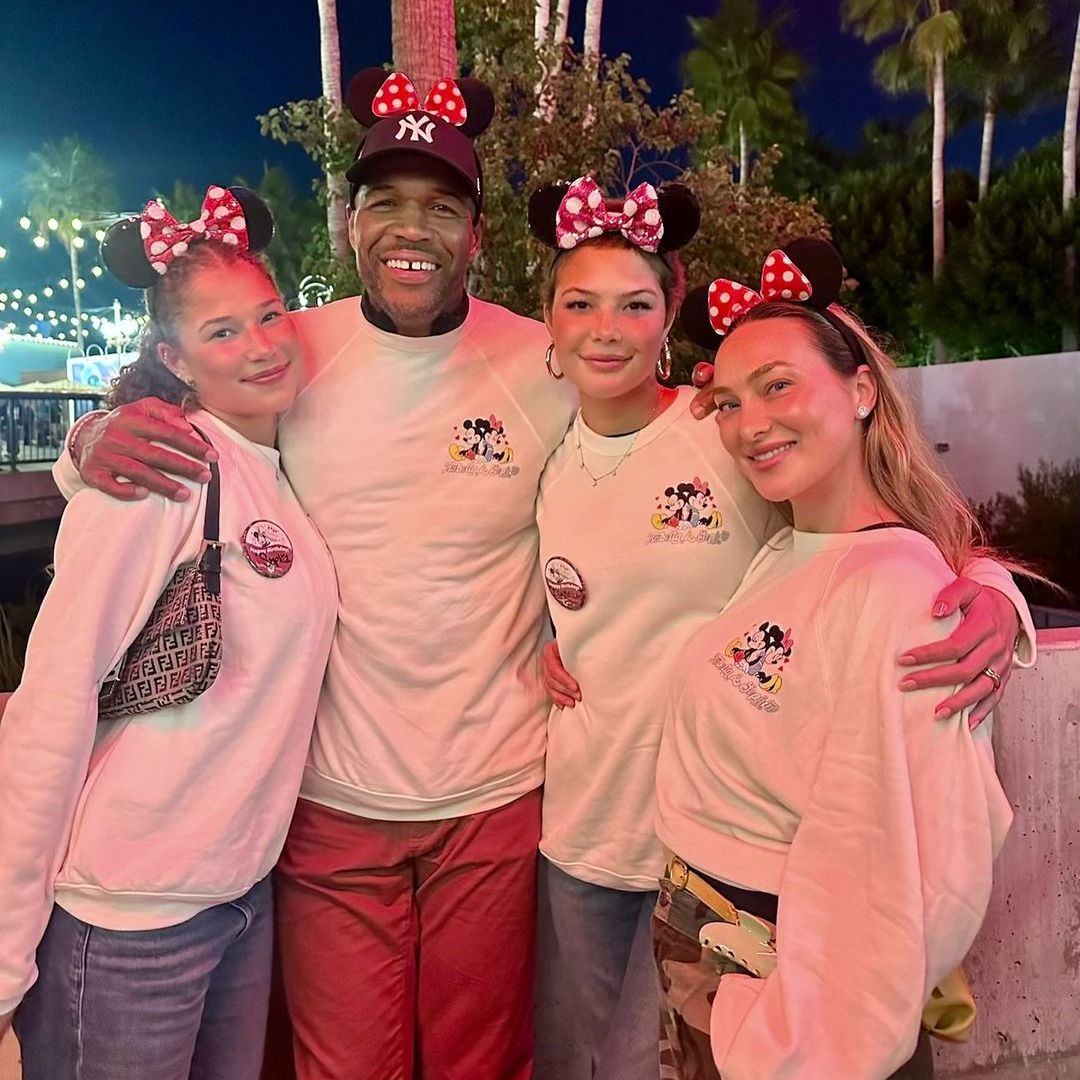 Michael Strahan celebrates his daughters Sophia and Isabella's birthdays at Disney with his girlfriend Kayla Quick