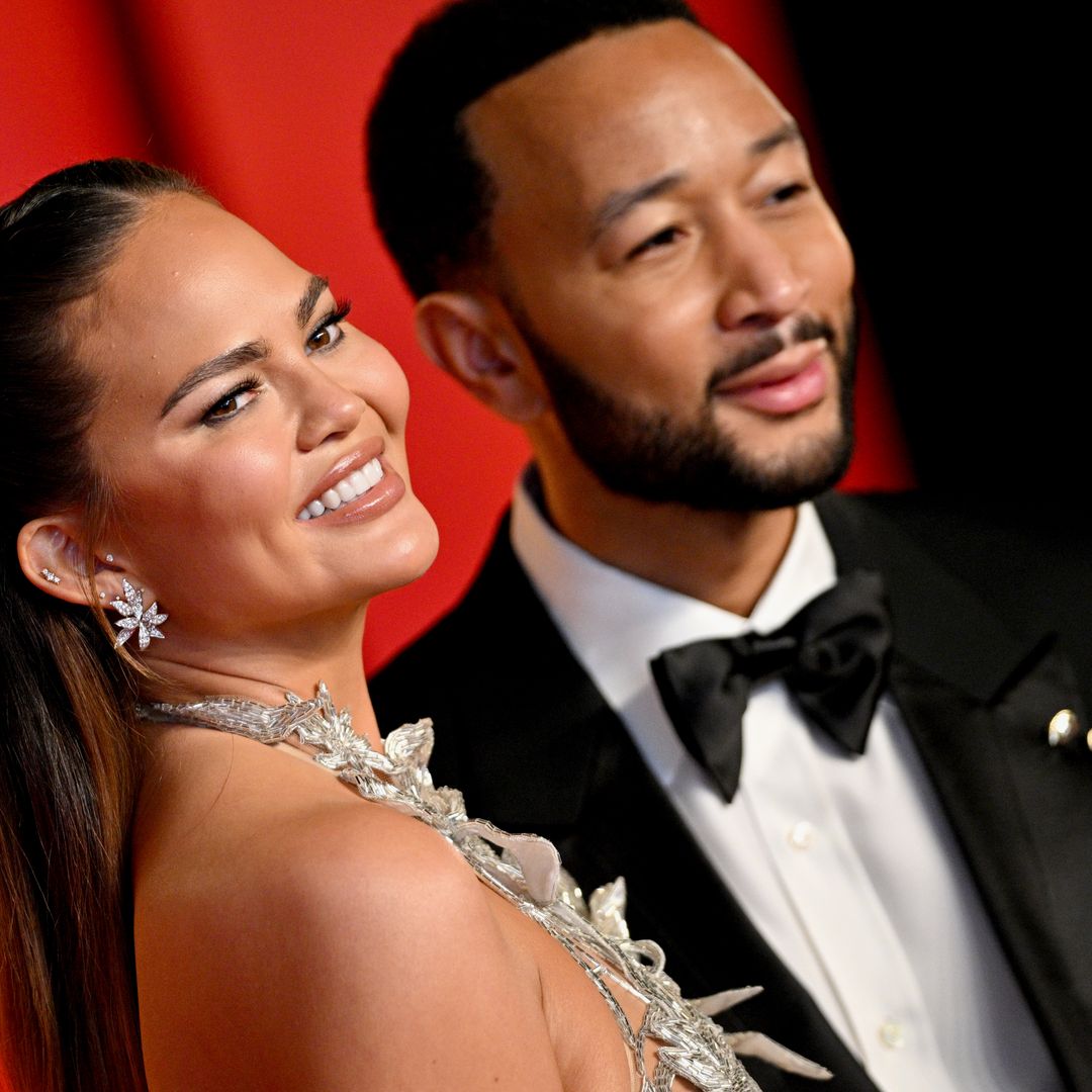 Chrissy Teigen cuddles up to babies Esti and Wren before Oscars after party