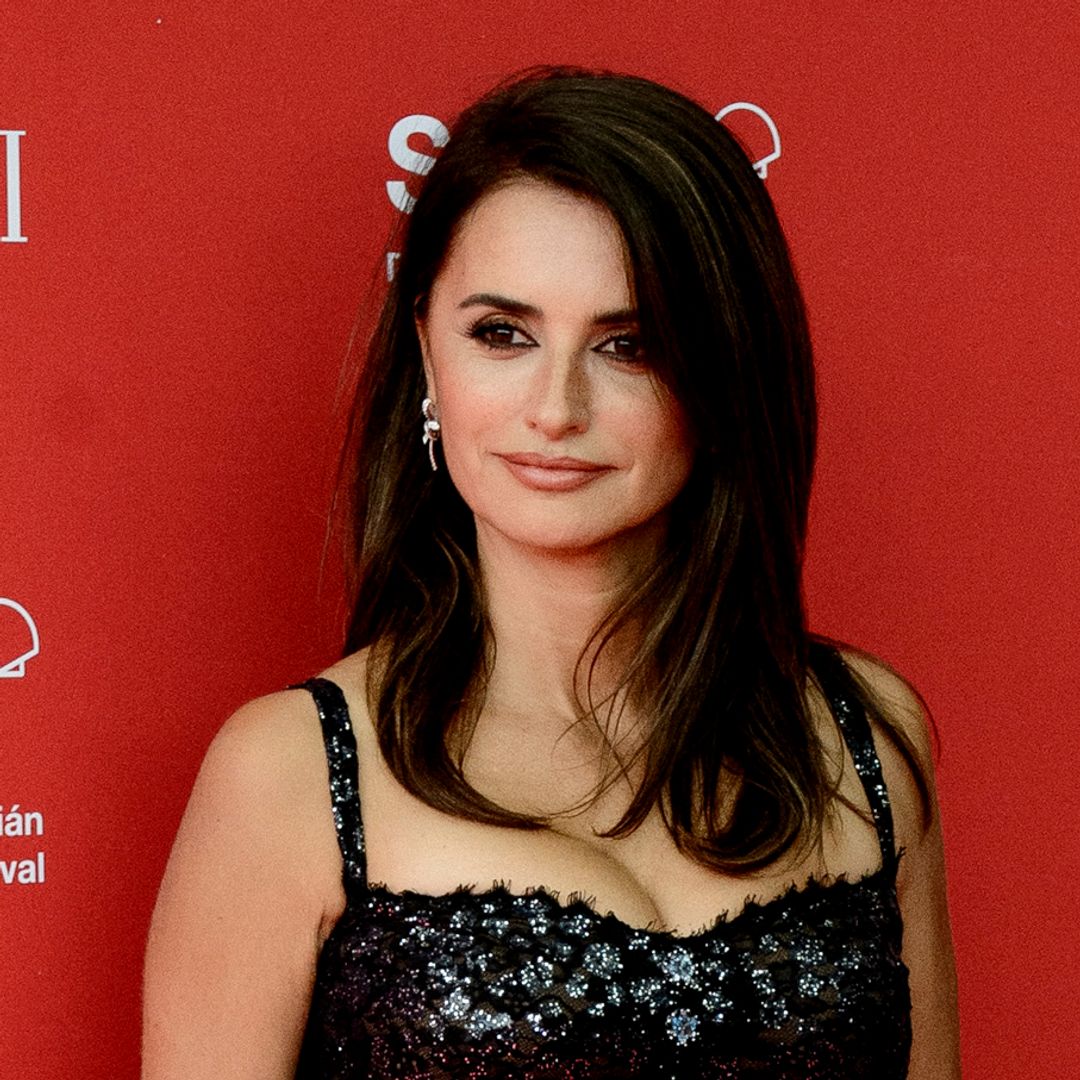 Penelope Cruz displays insanely toned legs in a Chanel white mini skirt and blazer