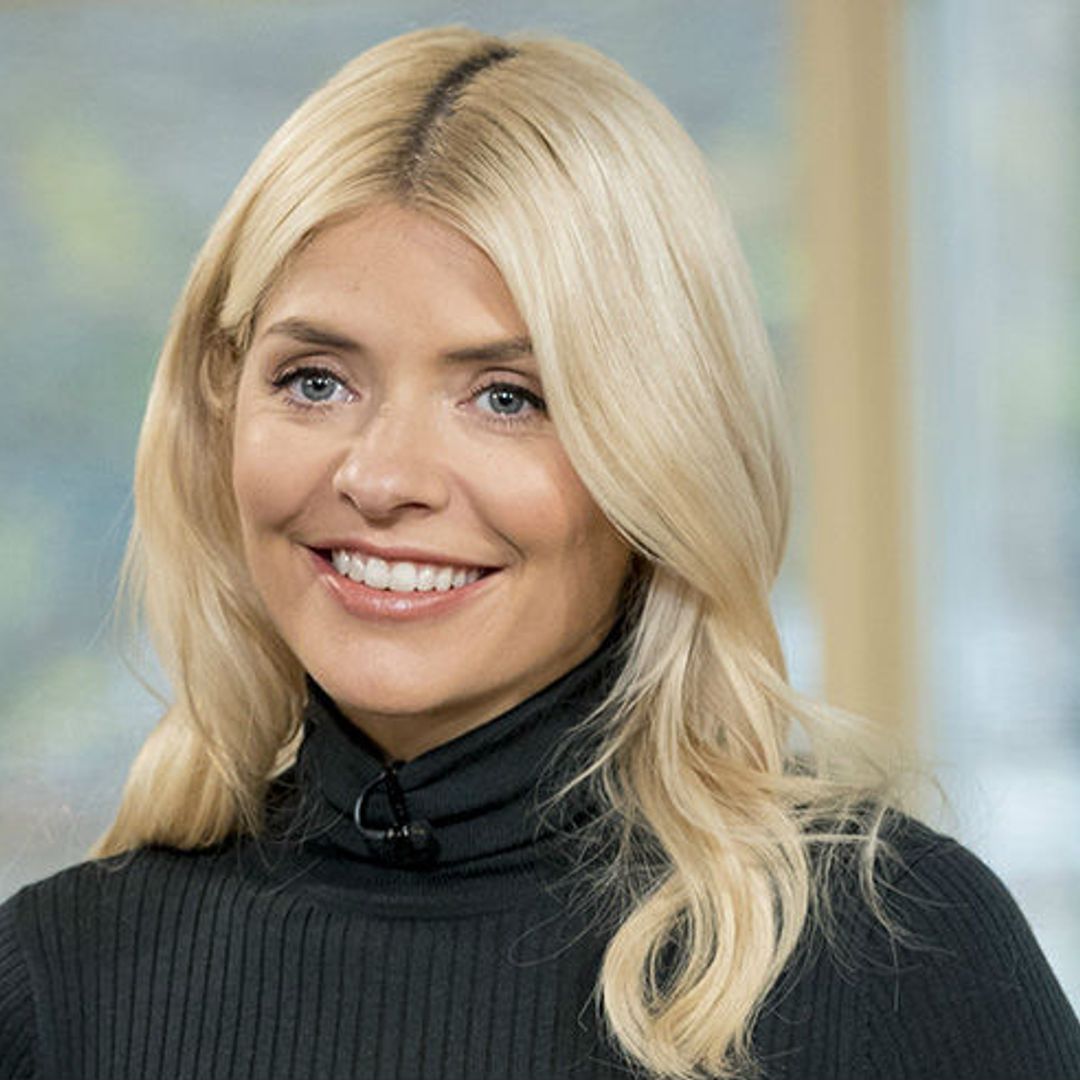 Holly Willoughby takes a dive with her son in £155 swimsuit