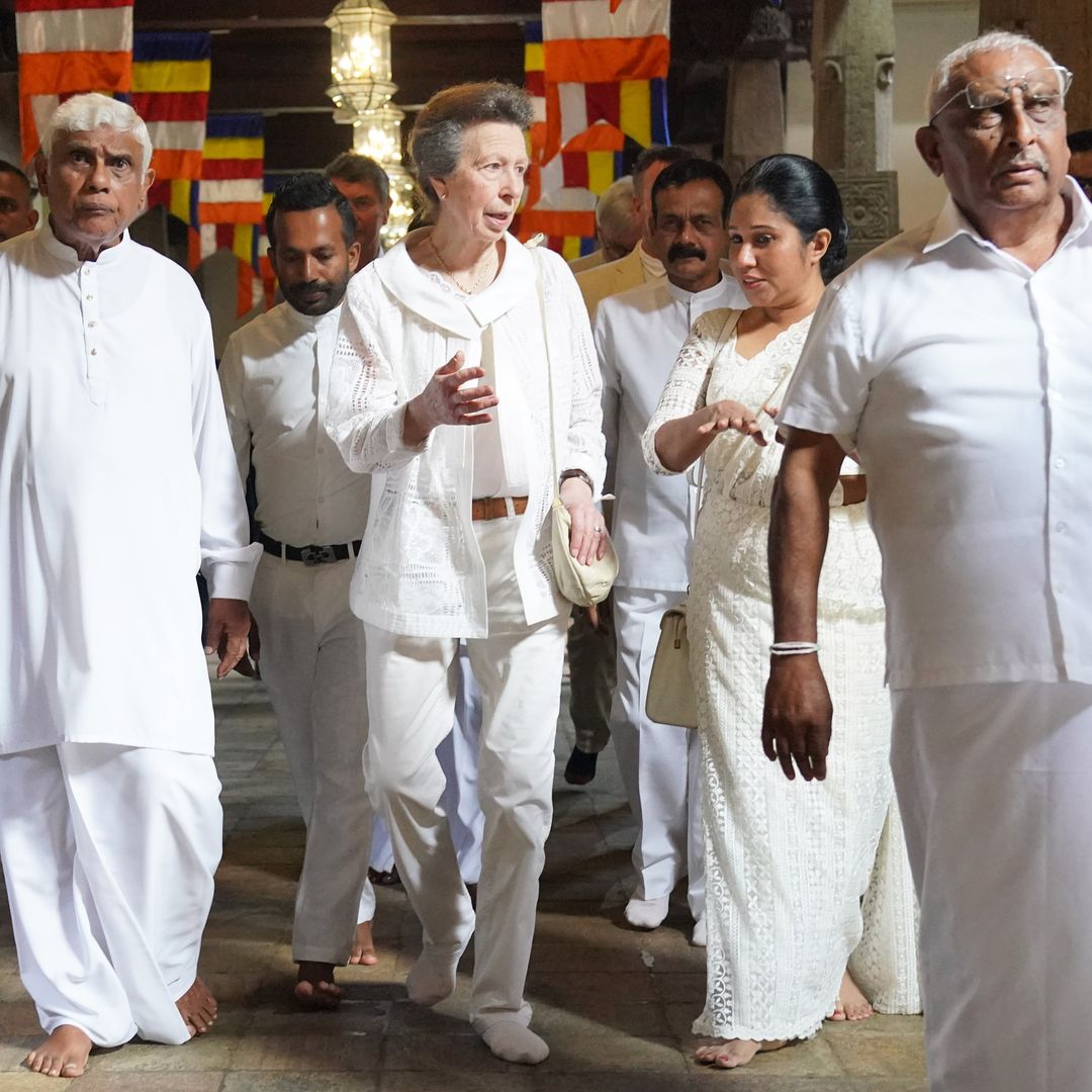 Princess Anne pays respects in all-white outfit at Buddhist temple on day two of Sri Lanka visit - best photos