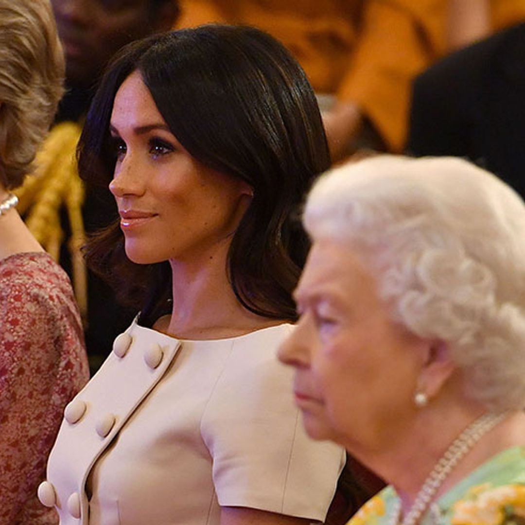 Meghan Markle mirrors the Queen as she perfects royal posture at Buckingham Palace