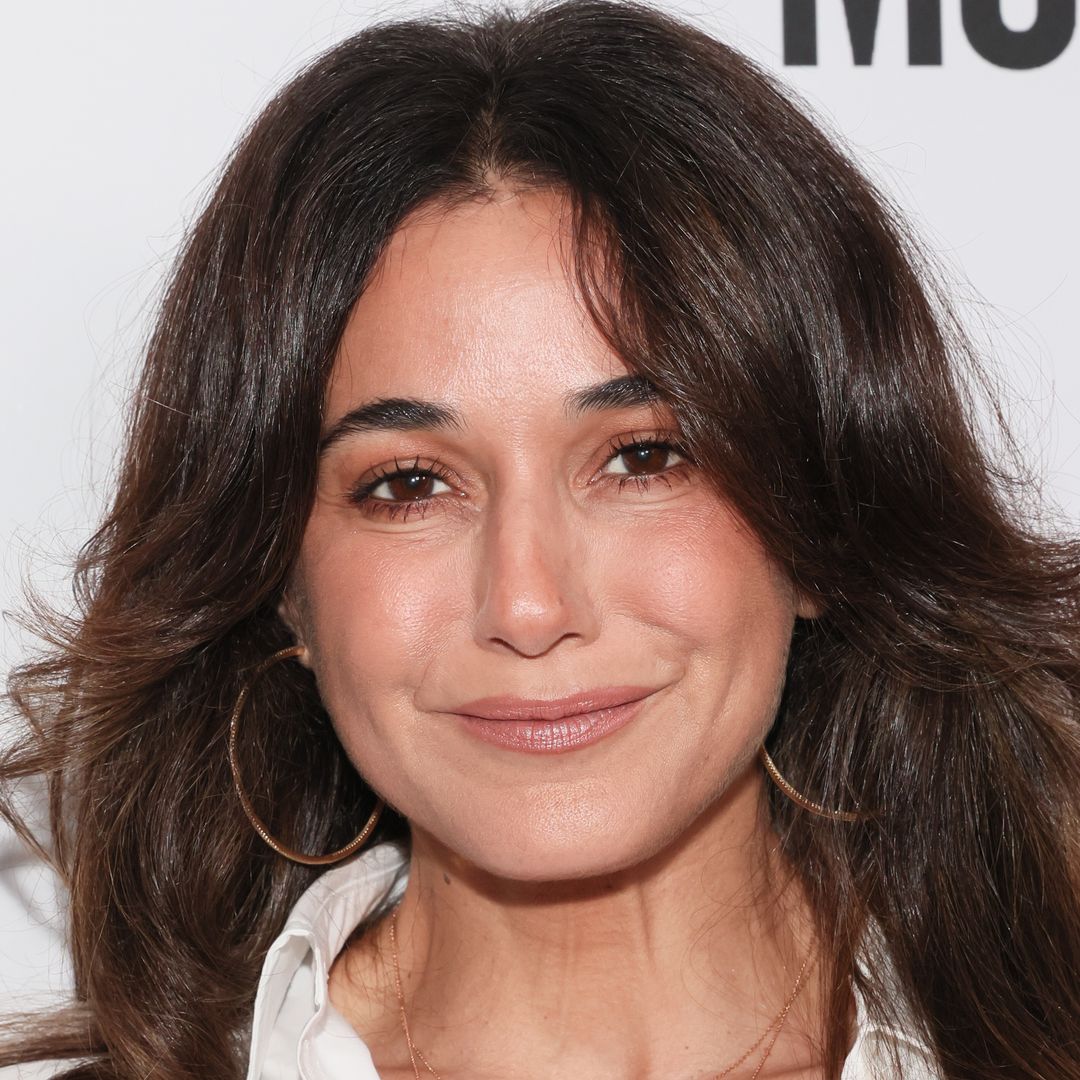 Emmanuelle Chriqui stuns in tiny red bikini on waterside vacation