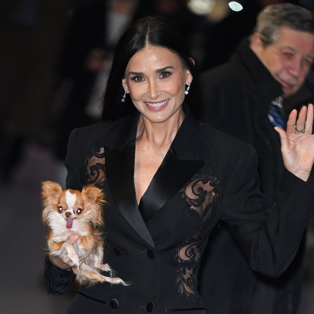 Demi Moore, 61, looks incredibly youthful as she steps out in black mini-dress with pup Pilaf