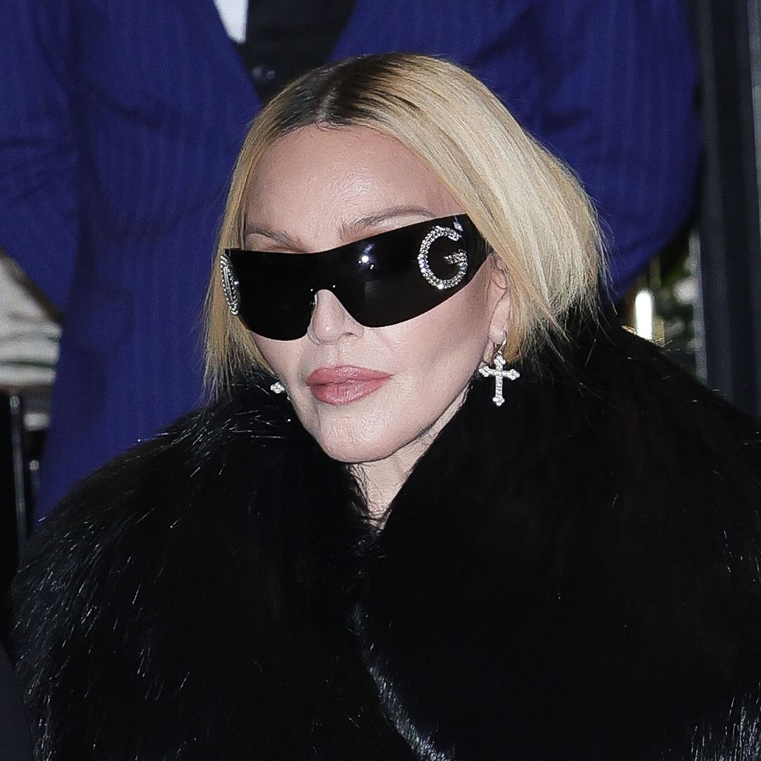 Madonna, 65, steps out in vampy fur-lined bodysuit and knee-high leather boots in Milan