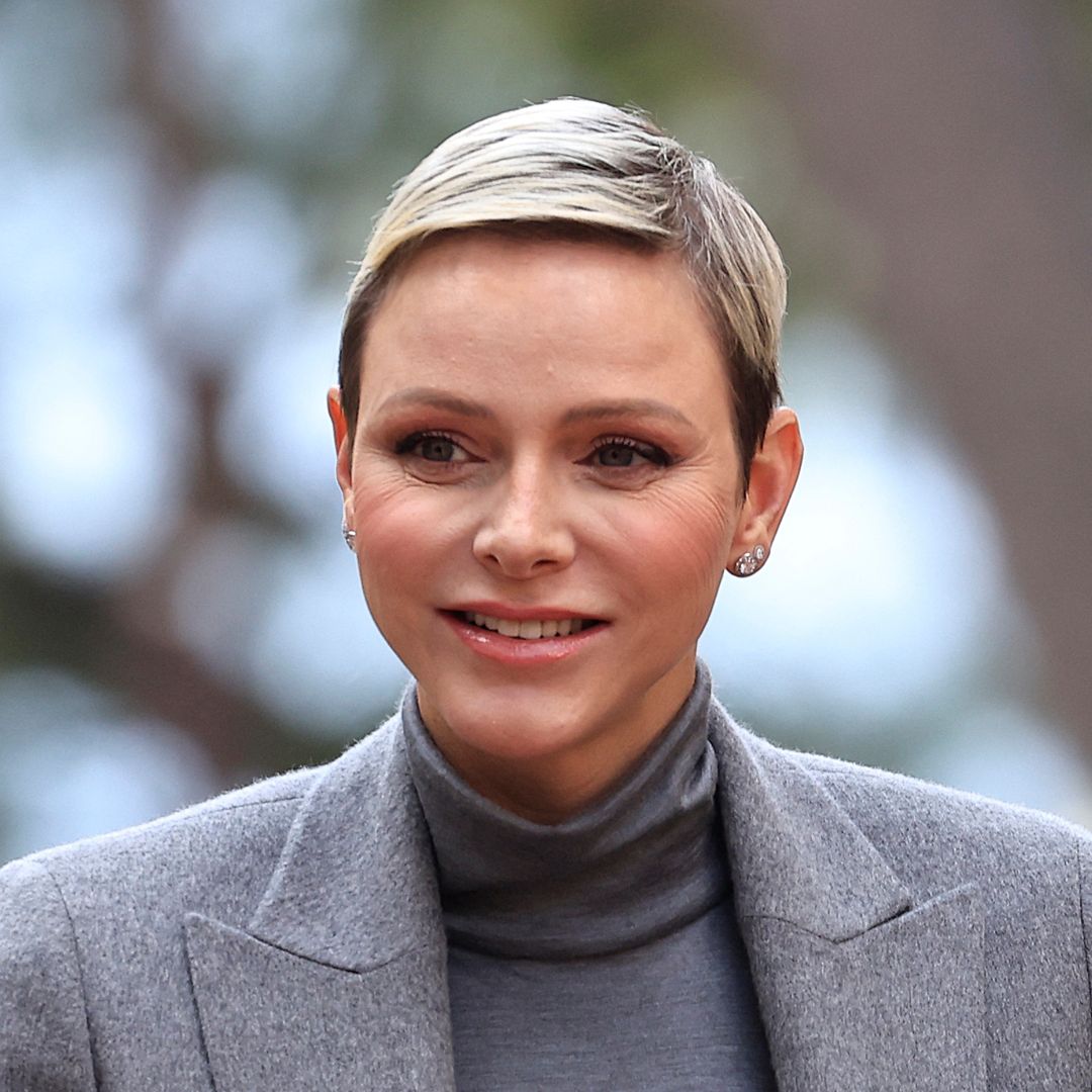 Princess Charlene's balletic updo conceals long hair transformation