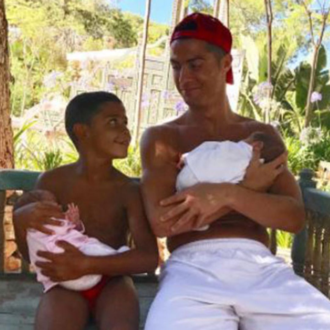 Cristiano Ronaldo's son dotes on newborn twins in adorable photo