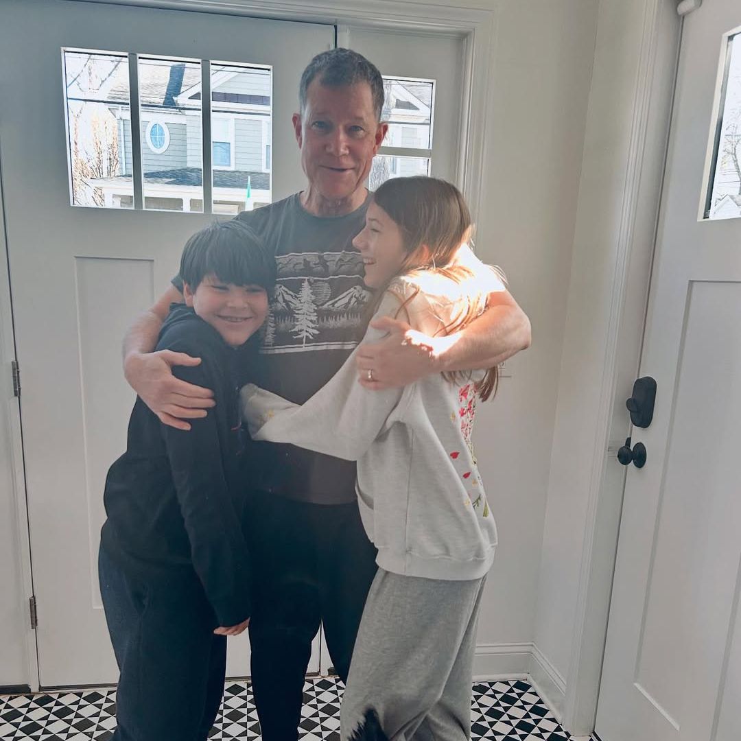 Dylan Walsh embraces his children Amelie and Hudson at home in a photo shared on Instagram by Leslie Borque-Walsh