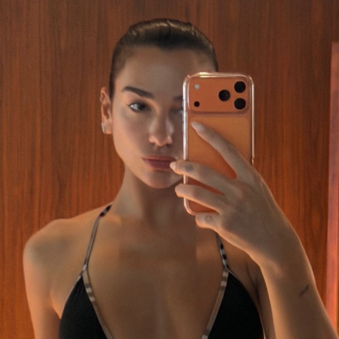 Bikini-clad Dua Lipa stuns alongside ripped fiancé Callum Turner in beachside photos