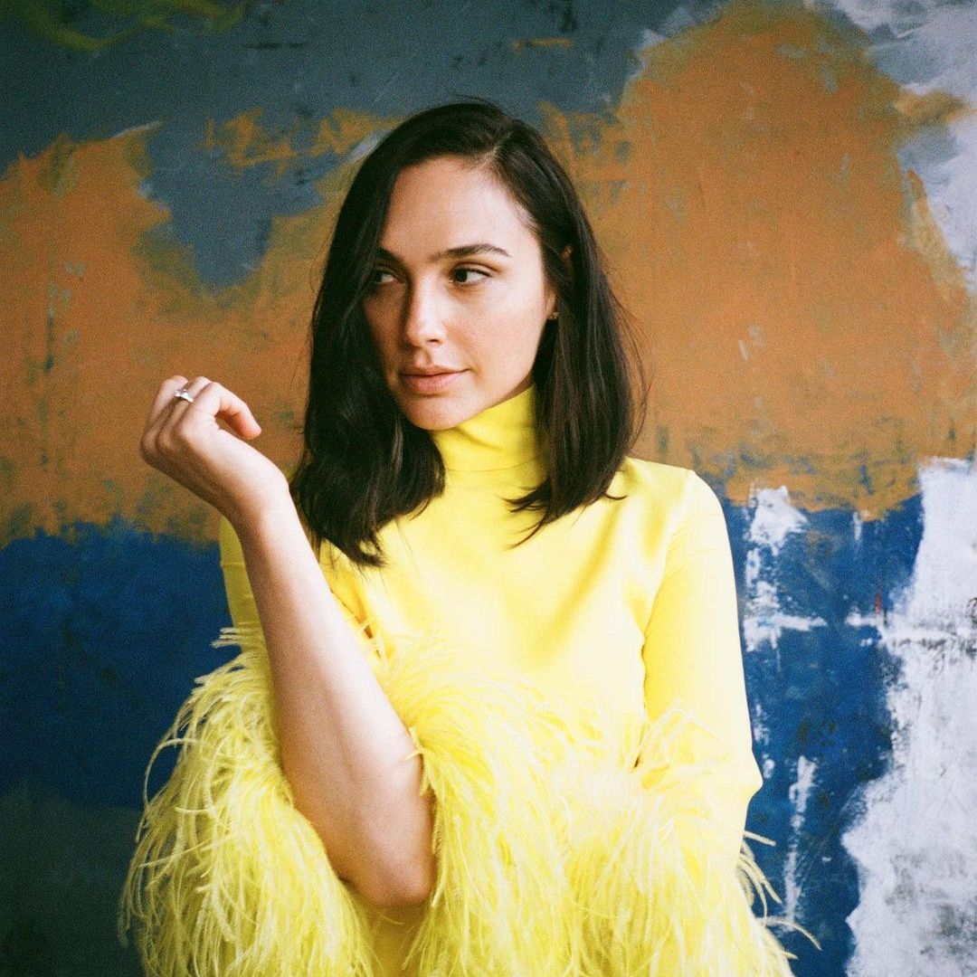 Gal Gadot looks incredible in a yellow feathered dress