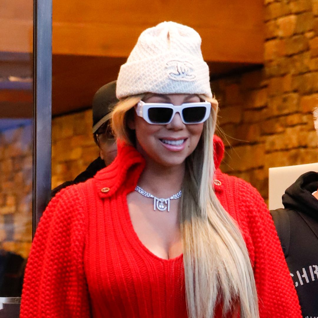 Mariah Carey rocks festive red mini dress and snow boots amid 'devastating' health setback