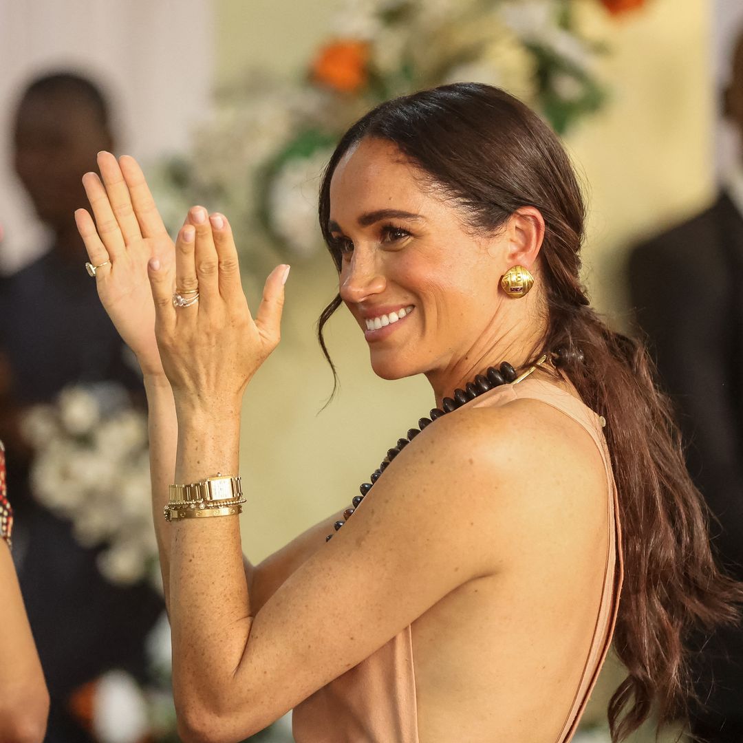 Meghan Markle is radiant in fitted bridal white look