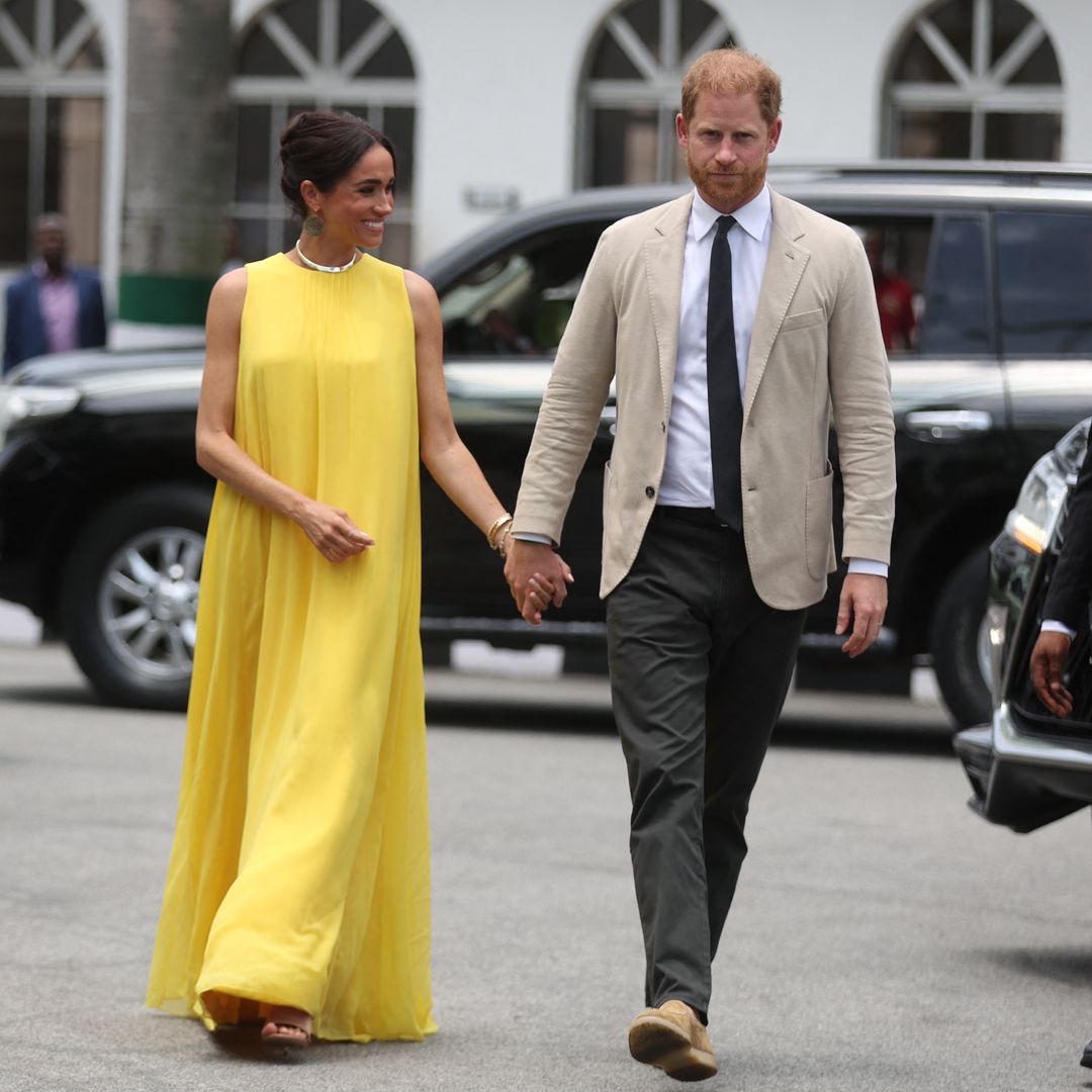 meghan markle yellow dress with prince harry on nigeria tour 