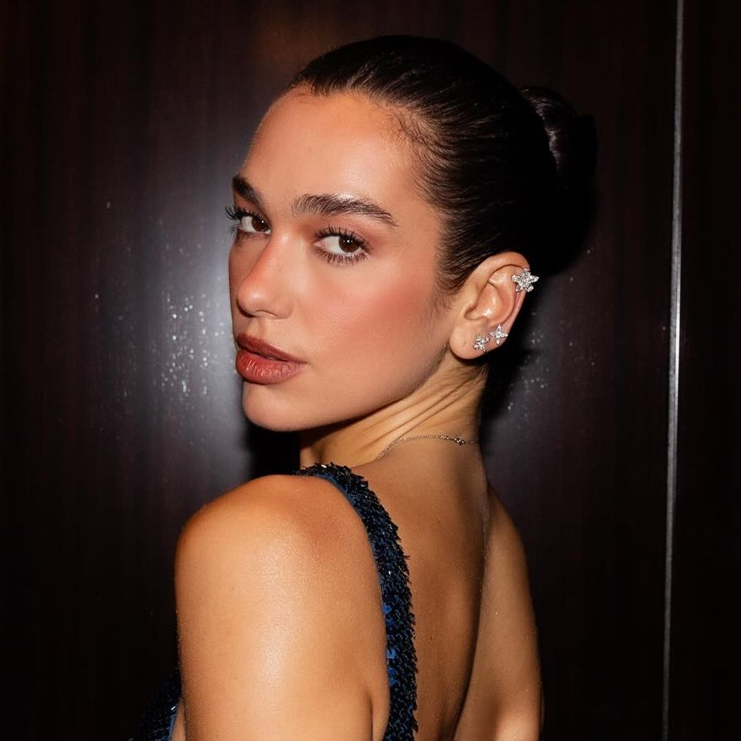 Dua Lipa's sheer sequin disc mini dress just went to the top of our party season wishlist
