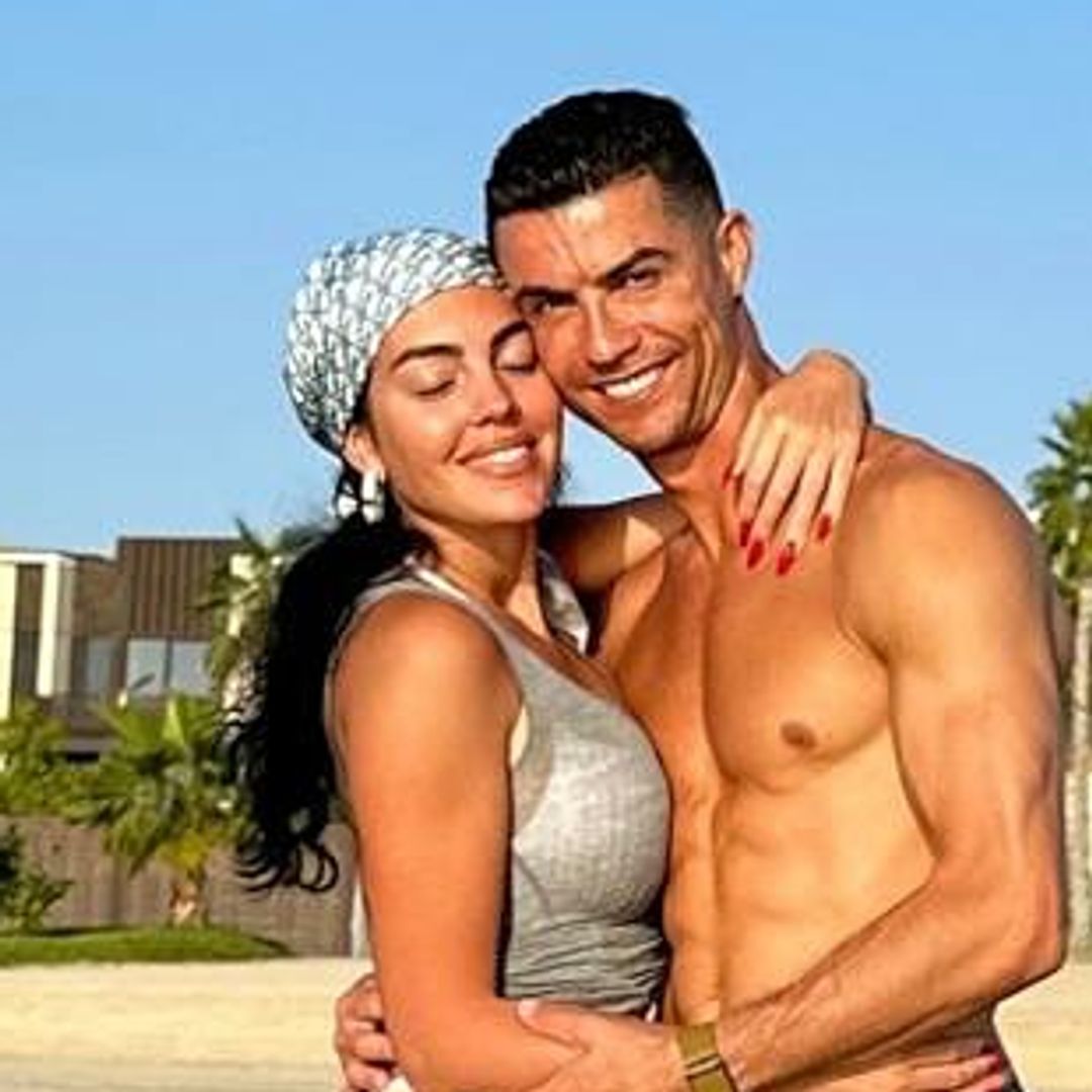 Cristiano Ronaldo poses in shirtless holiday snap alongside bikini-clad model girlfriend Georgina