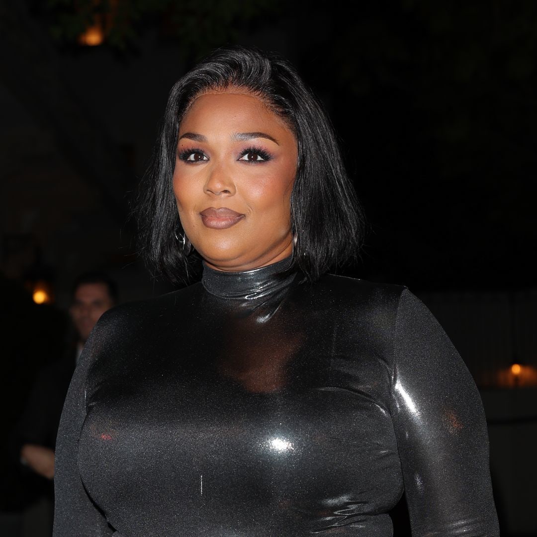 Lizzo looks slimmer than ever as she poses in white bikini